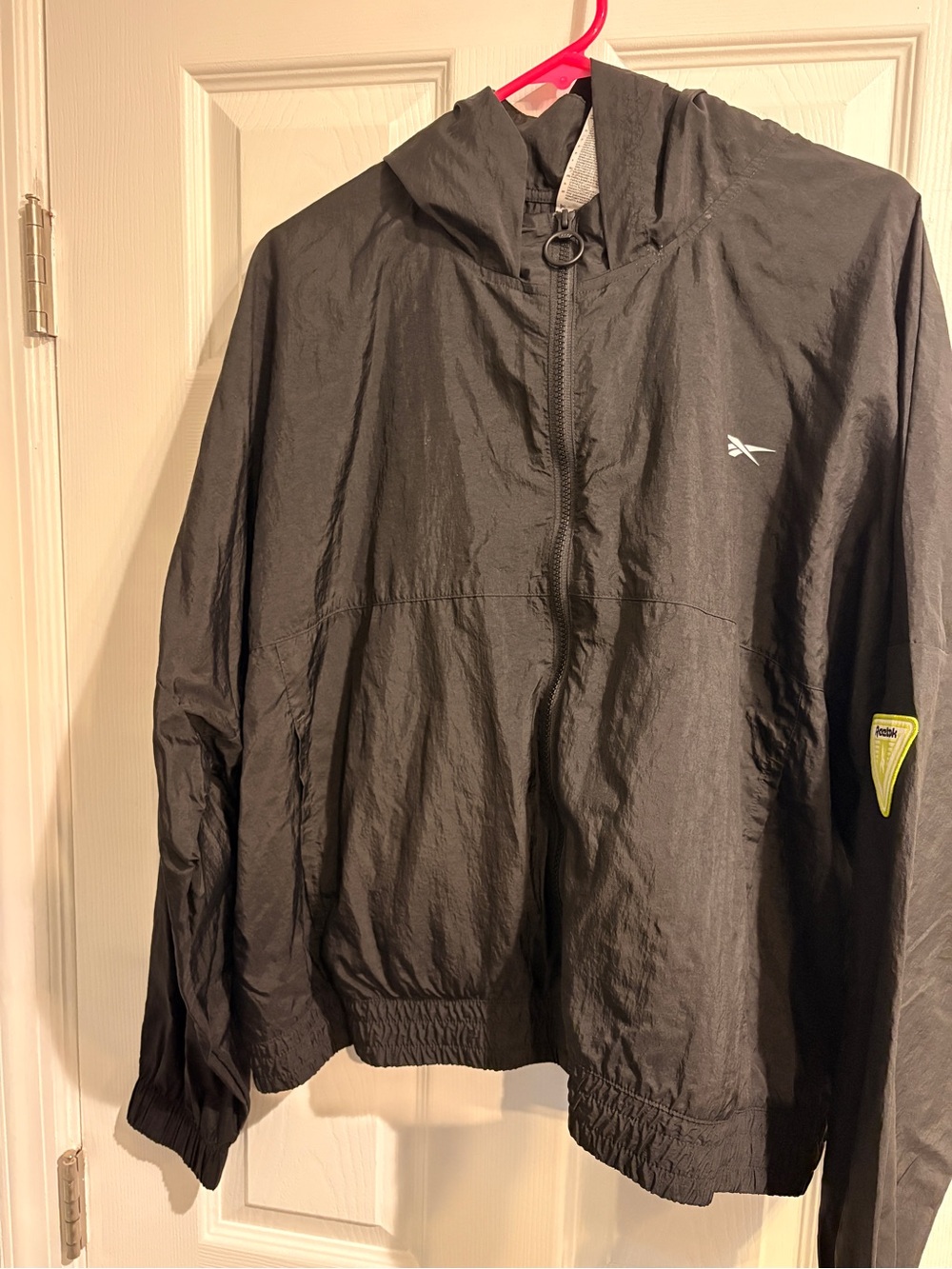 Reebok Women’s Crop Black Hooded Windbreaker Jacket with Subtle Vector Logo